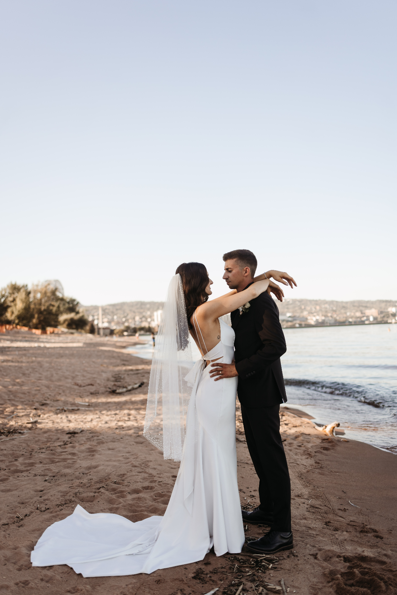 Bride and groom on the beach at sunset