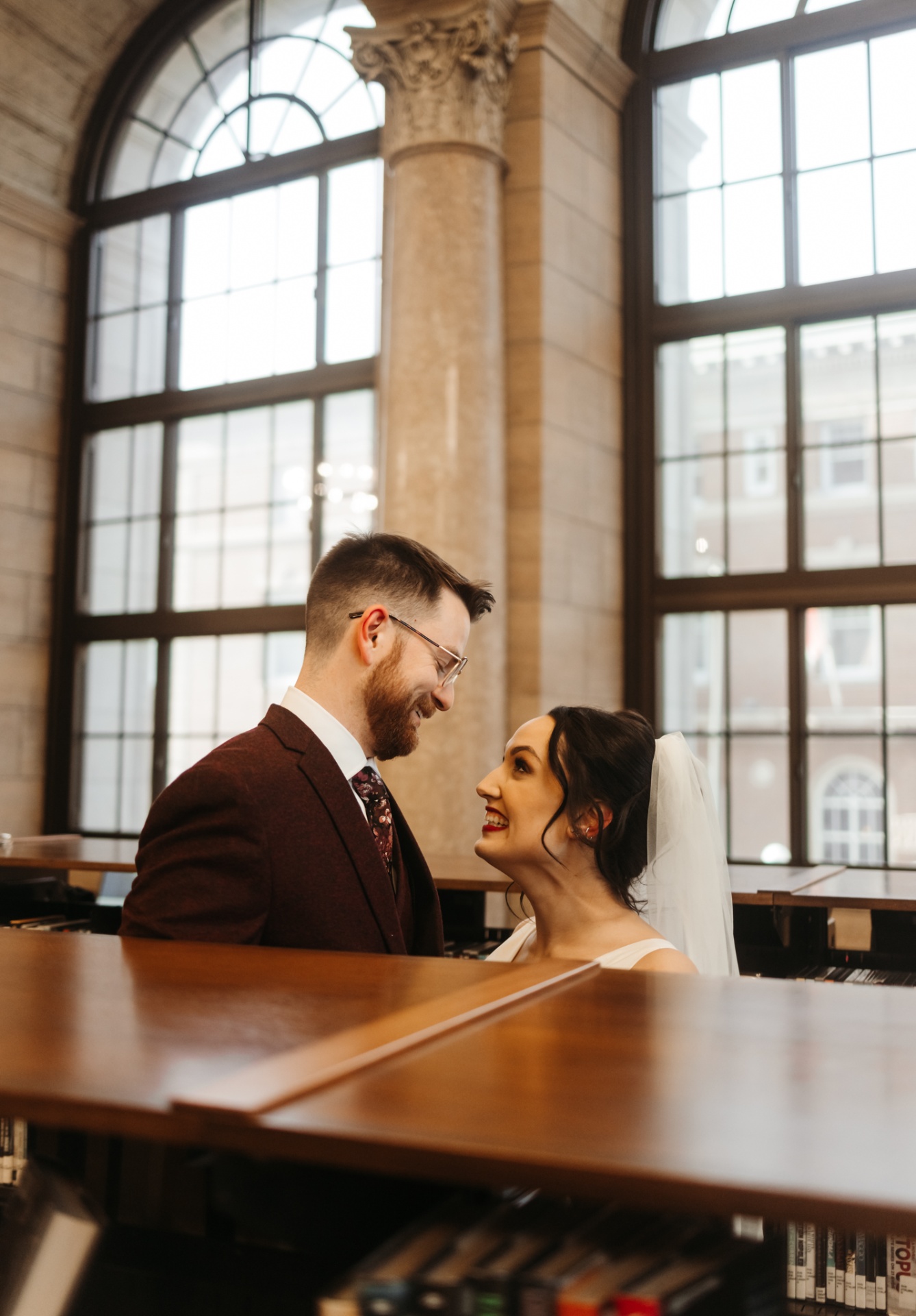 Couple laughing together in grand library