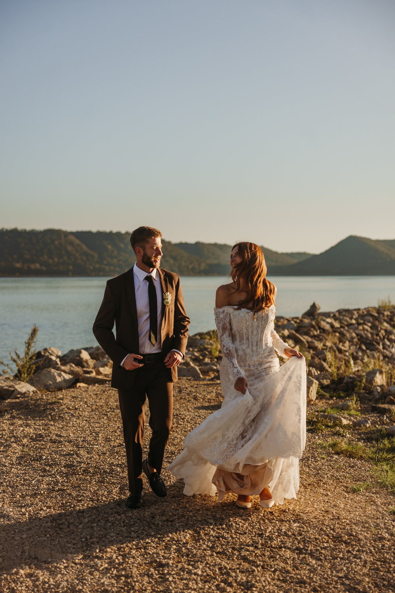 Couple at lakeside during golden hour